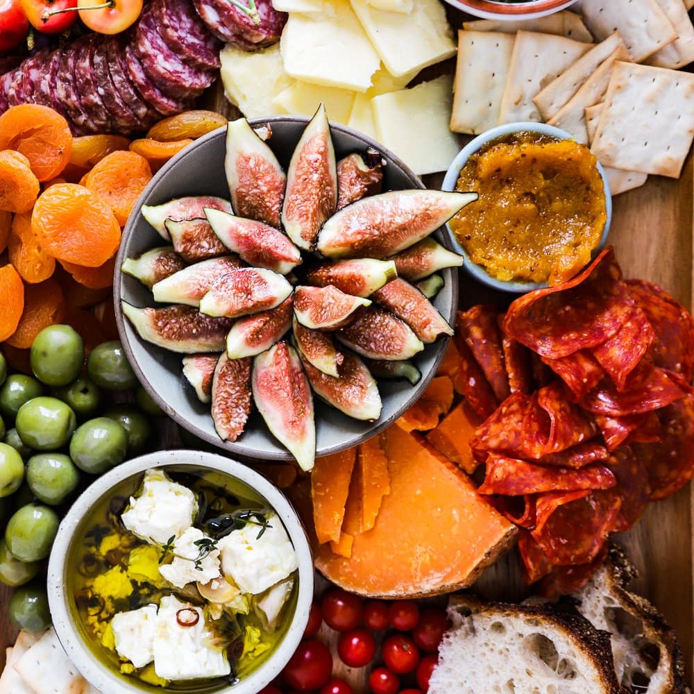 Honeyed figs, cheese, crackers and dips for you to build a better cheeseboard.
